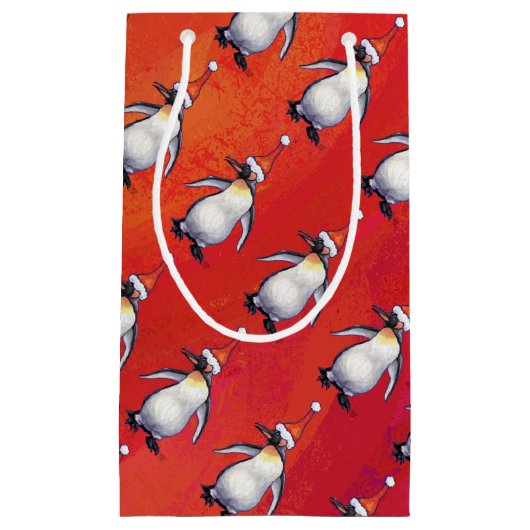 Festlicher Pinguin in einer Weihnachtsmannmütze Kleine Geschenktüte (Vorderseite)