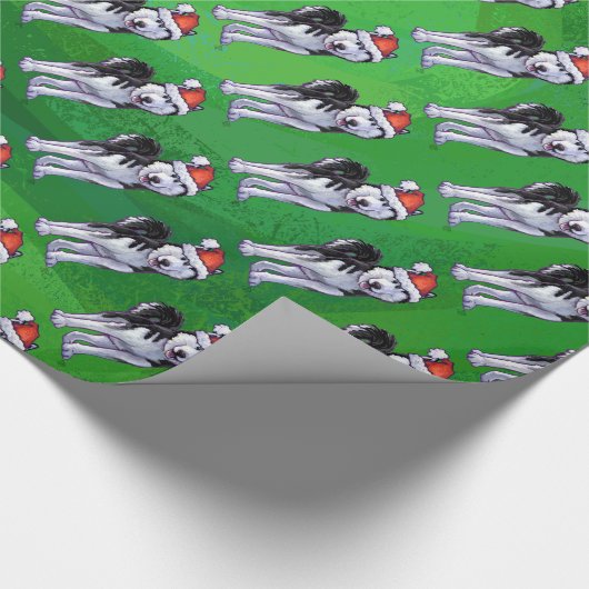 Festlicher Schlittenhund in der Geschenkpapier (Ecke)