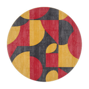 Fettes geometrisches Muster aus Rot, Gelb und Grau Schneidebrett