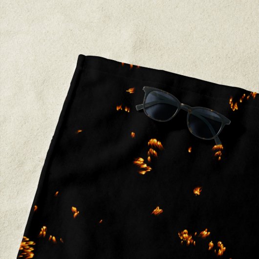 Feuerbrand überlagert das Foto, das die schwarzen Strandtuch (Beispiel)