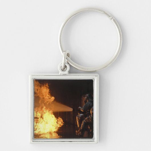 Feuerwehrleute löschen eine simulierte Batterie Schlüsselanhänger (Vorne)