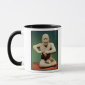 Figürchen eines Ringkämpfers Tasse (Links)