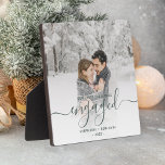First Christmas Engaged Photo Dark Green Script Fotoplatte<br><div class="desc">Commemorate your engagement with this beautiful modern keepsake plaque. The dark pine needle green text reads "Our first Christmas engaged, " with the word "engaged" in elegant handwriting script with flourishes before and after. Replace the sample image with your favorite photo, and add your names and the year. A white...</div>