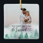 First Christmas Married Winter Forest 2 Foto Keramikornament<br><div class="desc">Create your own Double Sided Foto ornament with watercolor winter forest border. The wording reads "our first christmas married" in typewriter text and elegant calligraphy with a love heart. The foto template is set up for you to add 2 Fotos - one each side. You can also add your names...</div>