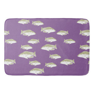 Fische auf lila badematte