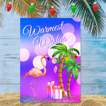 Flamingo Tropical Beach Weihnachten nach Wärme<br><div class="desc">Diese Gästekarte "Warmest Wwünscht Weihnachtsfeiertagen" mit einem rosa Flamingo mit dekorierten Ferienpalmen und Geschenken an einem beleuchteten tropischen Strandabend. Innen Gruß ~ "From Our Holiday Paradise to Yours". ^</div>