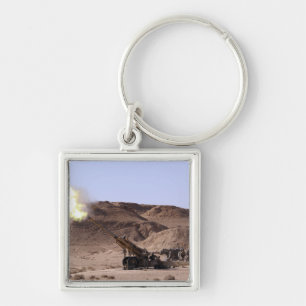 Flamme und Rauch taucht von der Mündung auf Schlüsselanhänger