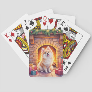Flauschiger Pomeranian an der gemütlichen Weihnach Spielkarten