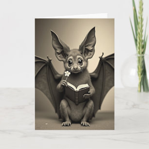 Fledermaus mit Buch und Blumenkarte Karte