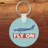 Fliegen im Flugzeug Schlüsselanhänger (Vorderseite)