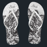 Flip Flops aus schwarzem Flor und weißem Glitzer Badesandalen<br><div class="desc">Wunderschön aussehende Flop Shoes mit Imitate schwarze Blumenspitze auf einem Imitat weißen Glitzer Hintergrund bereit für Sie mit Ihrem Namen oder Brautparty Titel personalisieren. ⭐ Dieses Produkt ist zu 100% benutzerdefinierbar. *****Klicken Sie auf die SCHALTFLÄCHE ANKLICKEN, um hinzuzufügen, zu löschen, zu verschieben, zu verändern, umzudrehen, zu drehen, etc... alle Grafiken...</div>