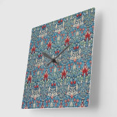 Floral pattern on green leaves blue background quadratische wanduhr (Winkel)
