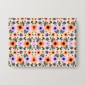 Floral-patterned envelope with vibrant orange  button (Vorderseite)