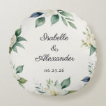 Floral Wedding Keepsake Elegant Decor Personalized Rundes Kissen<br><div class="desc">A timeless keepsake to commemorate a beautiful beginning, this personalized botanical wedding pillow features a soft floral design which encircles the couple’s names and wedding date. Refined and romantic, the elegant cushion is designed to complement sophisticated wedding aesthetics, from garden ceremonies to formal estate celebrations. The delicate greenery and white...</div>