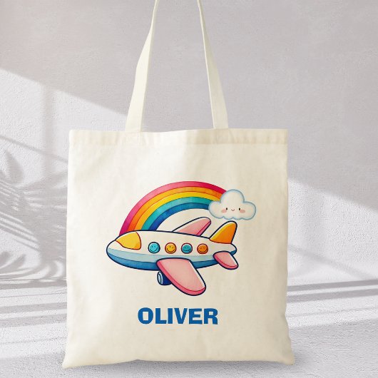 Flüchtiges Flugzeug mit Regenbogen Tragetasche