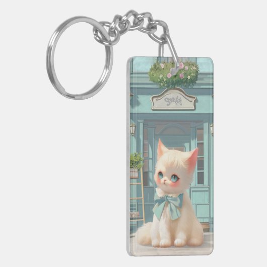 Fluffy Kitten mit Blue Bow im Konditorladen Schlüsselanhänger (Vorderseite links)