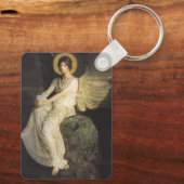 Flügelfigur, sitzend auf einem Felsen von Abbott T Schlüsselanhänger (Rückseite)