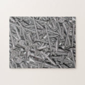 Folie aus silberfarbenen Trockenmauer-Schrauben Puzzle (Horizontal)