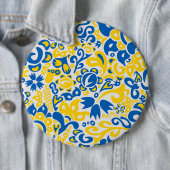 Folklore-Muster mit ukrainischen Flaggenfarben Button (Beispiel)
