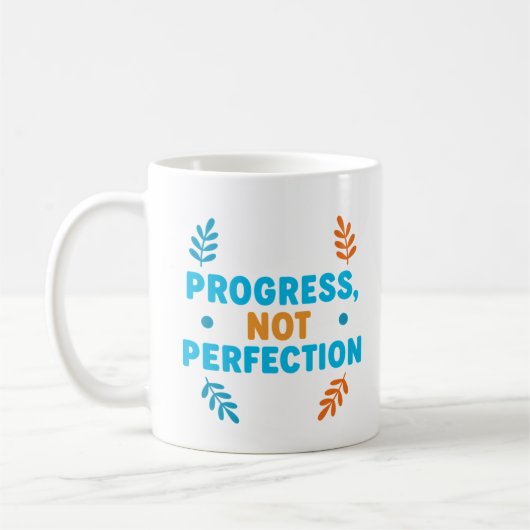 Fortschritt, nicht Perfektion – Motivationsbecher Kaffeetasse (Links)