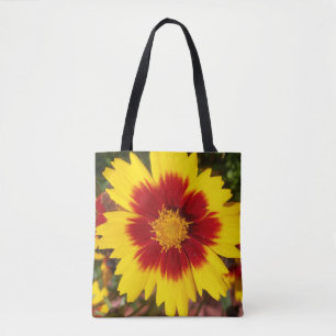 Foto einer gelben und roten Coreopsis-Blume auf Tasche