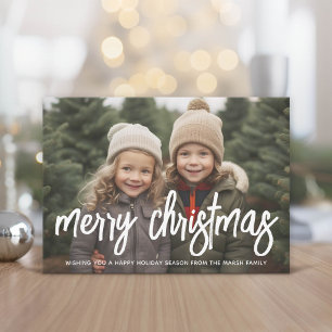 Foto mit riesiger MERRY-Schrift weißer Überlagerun Feiertagskarte