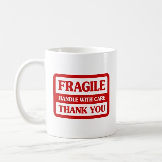Fragile Handhabung mit Vorsicht Kaffeetasse (Links)