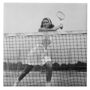 Frau, die Tennis spielt Fliese