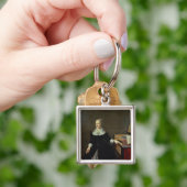 Frau durch einen Virginal Schlüsselanhänger (Hand)
