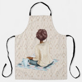 FRAU SITZT AUF BLANKET MIT WARTEEM GETRÄNK SCHÜRZE (Vorderseite)