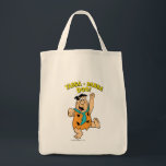 Fred Flintstone Yabba-Dabba Doo! Tragetasche<br><div class="desc">Die Steine | Karo aus Fred Flintstone mit seinem berühmten Schlagwort "Yabba-Dabba Doo!".</div>