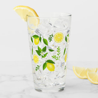 Fresh lemons with flowers and leaves glas