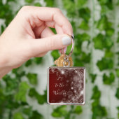 Freude an der Welt mit weißen Schneeflocken auf Ro Schlüsselanhänger (Hand)