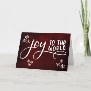 Freude der Welt-Typografie und Schneeflocken Feiertagskarte