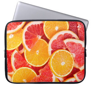 Frische reife Orange- und Grapefruituntergrund Laptopschutzhülle