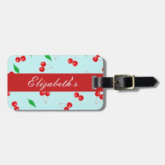 Frische rosa Kirschen auf einem tadellosen Gepäckanhänger (Vorderseite horizontal)