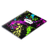 Frischer Retro Neonfarben-Spritzer auf Schwarzem Notizblock (Linke Seite)