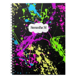 Frischer Retro Neonfarben-Spritzer auf Schwarzem Notizblock