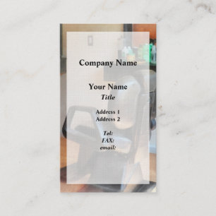 Friseurstuhl und Haarzubehör Visitenkarte