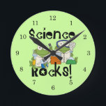 Frogs Science Rocks Runde Wanduhr<br><div class="desc">Two frogs with lab coats and safety goggles doing lab experiments on Science Rocks T-shirts,  hoodies,  buttons,  cards,  mugs,  magnets,  keychains,  journals,  mousepads,  and other Science Rocks apparel and gifts that are sure to get a few laughs and second looks!</div>