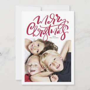 Frohe Weihnachten Handschrift in rotem Foto