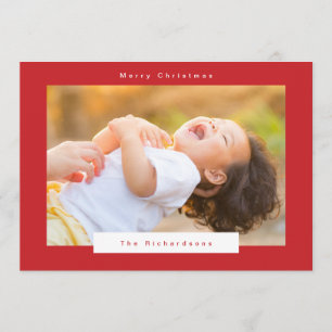 Frohe Weihnachten in rotem und weißem Text Foto