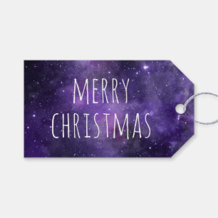 Frohe Weihnachten. Lila Winterurlaub Geschenkanhänger