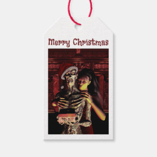 Frohe Weihnachten. Lustiges Skelett mit Frau Geschenkanhänger
