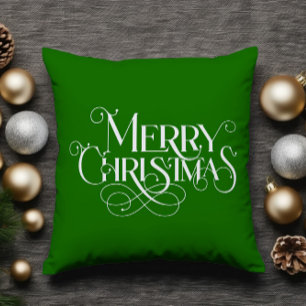 Frohe Weihnachten Retro-Weiß-Typografie auf Grün Kissen