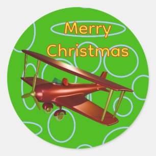 Frohe Weihnachten Rotes Doppeldeckerflugzeug auf g Runder Aufkleber