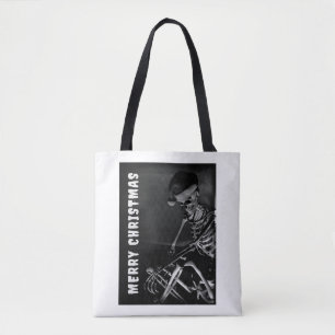 Frohe Weihnachten. Skelett mit Weihnachtsmannmütze Tasche