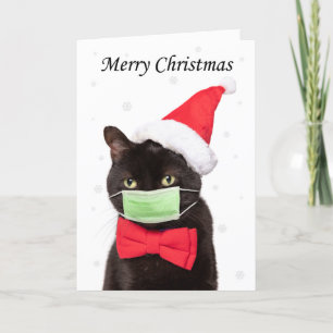 Frohe Weihnachten Süße Katze in Santa Hut und Mask