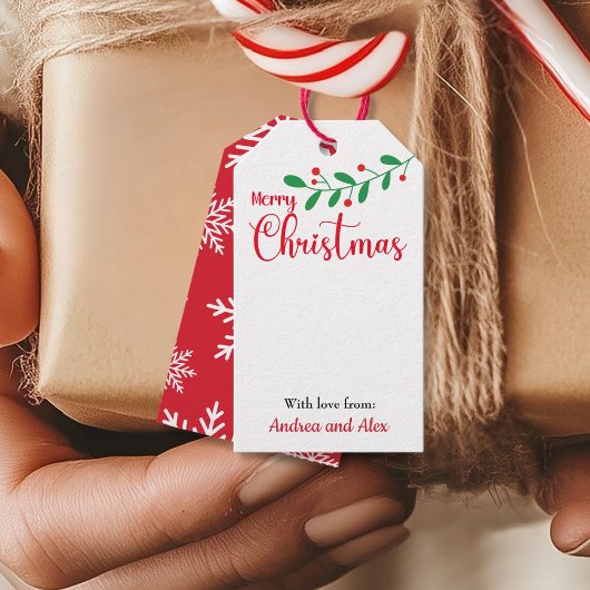 Frohe Weihnachts-Mistletoe-Filiale und Schneeflock Geschenkanhänger