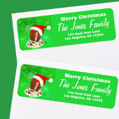 Frohe Weihnachtsfußball mit Weihnachtsmannmütze un